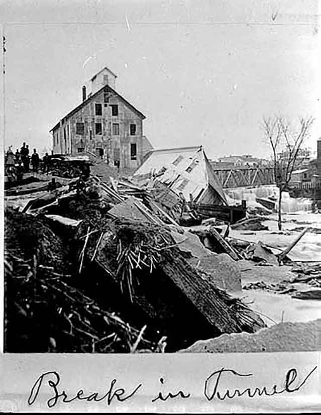 black and white photo of collapse of sawmills on the falls
