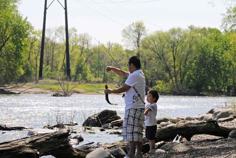 Man and child fishing in the river