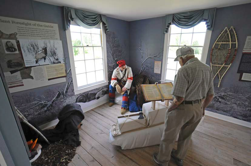 Man views display in historical house