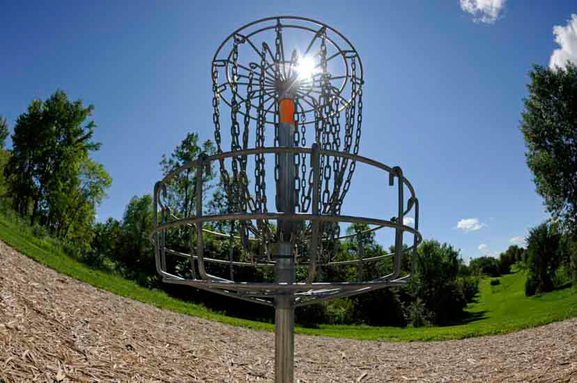 Disc golf basket and hillside