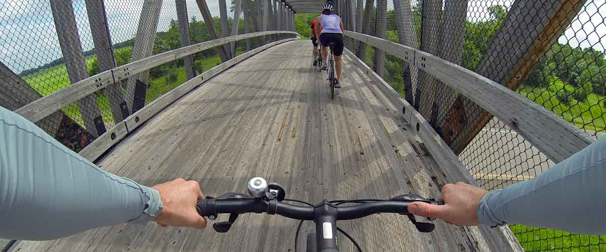 Bikers on bridge over highway