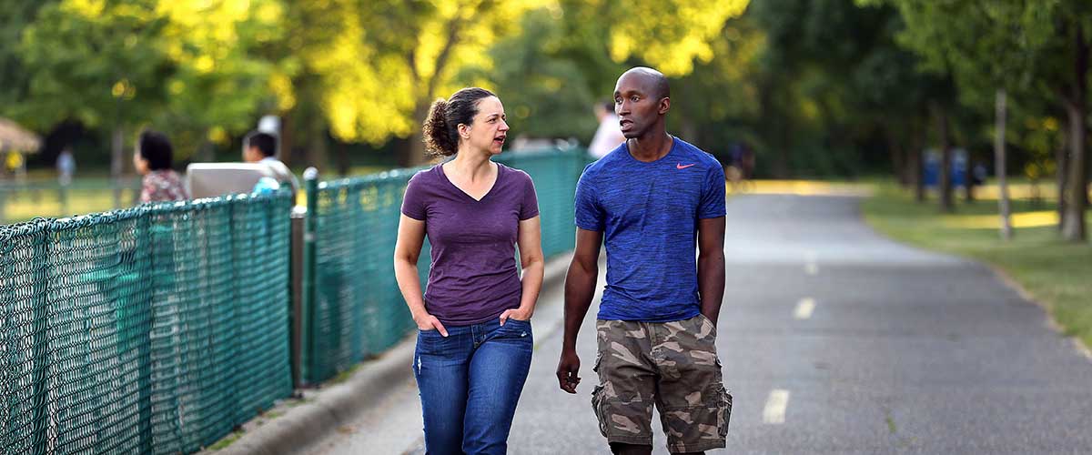 Couple walking on a paved trail