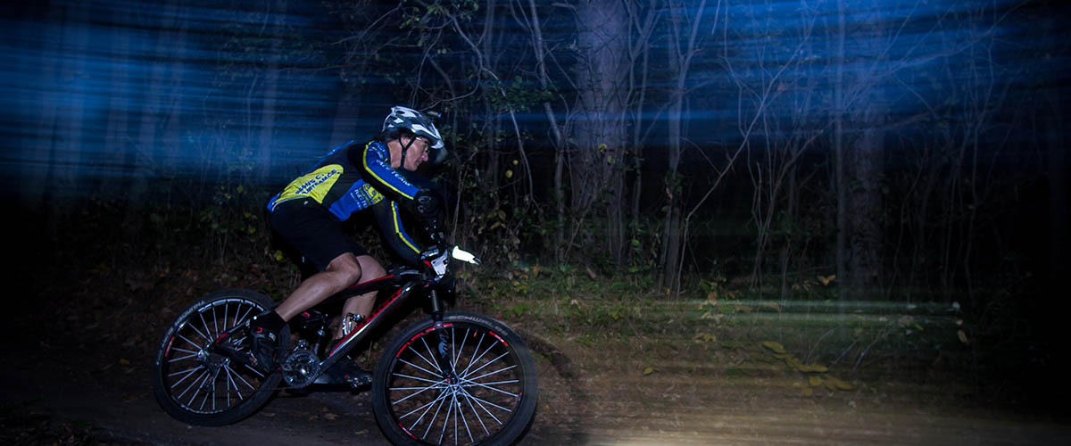Mountain biker at night with headlight