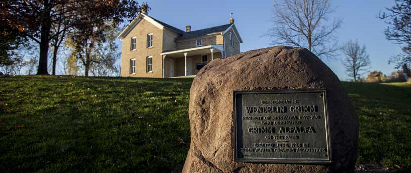A monument to Wendelin Grimm in front of the Grimm farmhouse