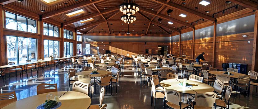 The inside of the Silverwood Great Hall is set with tables and chairs.