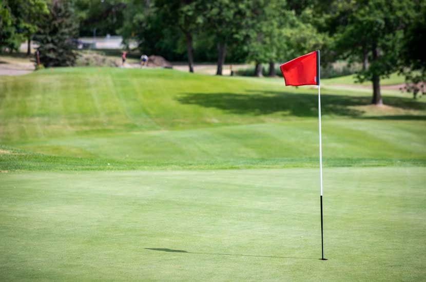 A red flag waves on Hyland Greens golf course.