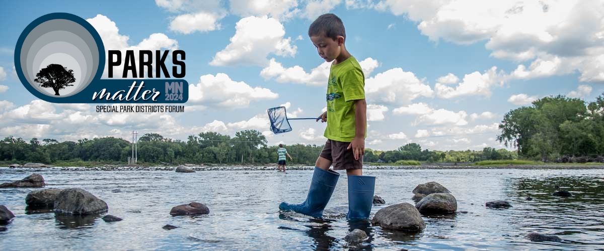 Photo of a boy wearing rubber boots while walking across rocks in water with a fish net in hand. On the left side of the image is the logo for the event, that says Parks Matter MN 2023, Special Park Districts Forum.
