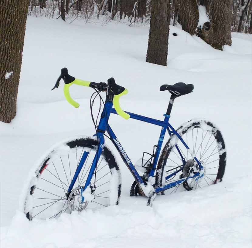 A bike in deep snow.