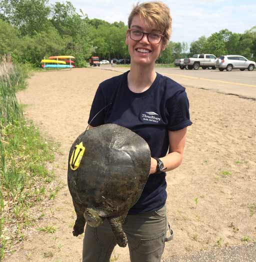 staff holding a turtle