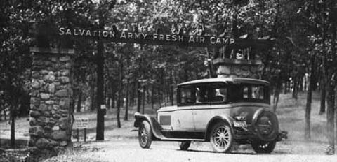 Photo of a car in front of the sign for the Salvation Army Fresh Air Camp entrance. Courtesy of Minnesota Historical Society.