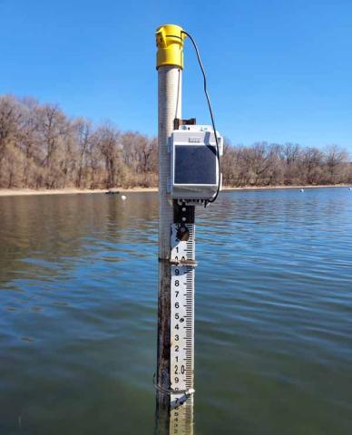 Photo of a HOBO monitor taking measurements on Hyland Lake.
