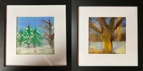 Photo of two felted landscape artwork pieces. The left one is of snow-covered evergreens and the right one is mostly of the trunk of a tree.